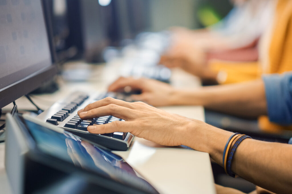 Technical support team working at desktop computers