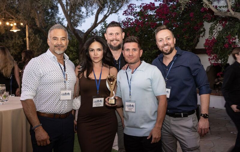 Dispensify team and industry colleagues holding an award at CannaPac in Arizona