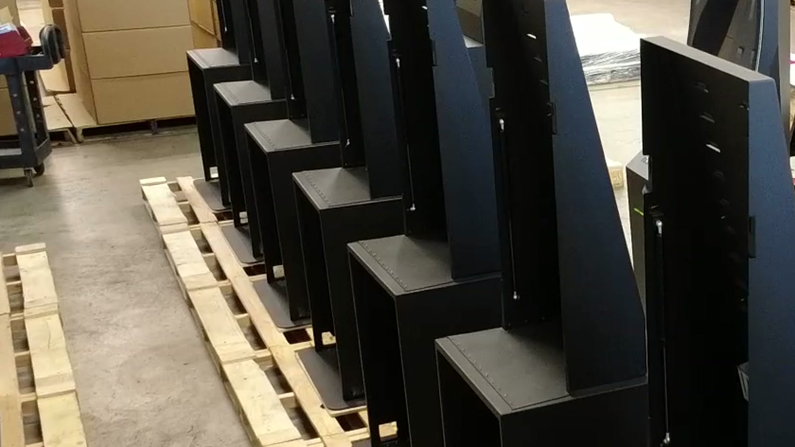 Rows of Giosk Cash kiosk hardware staged during custom kiosk manufacturing