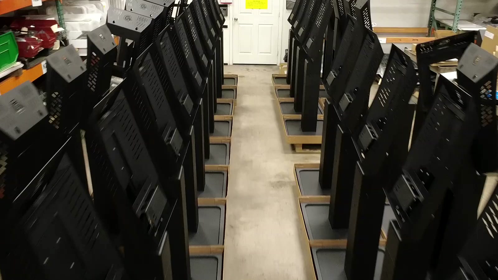 Rows of Dispensify kiosk enclosures staged during the custom cannabis retail hardware build process